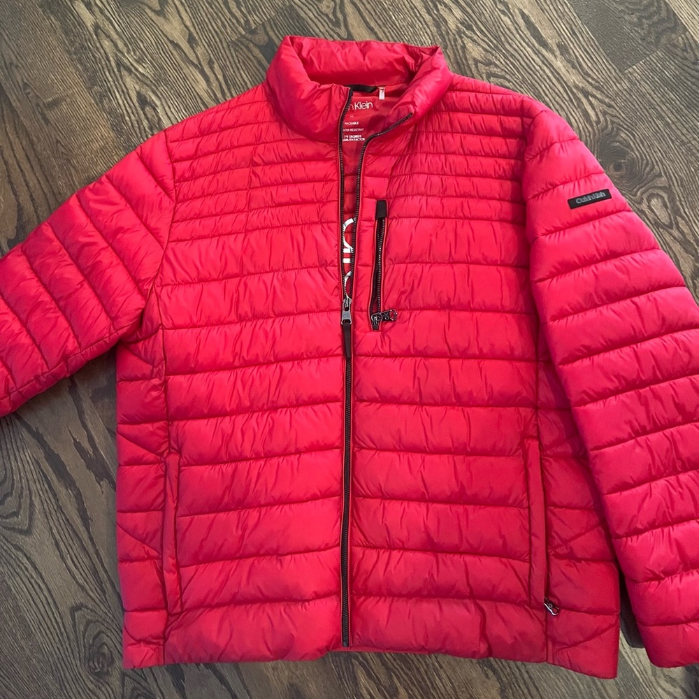 Like new red Calvin Klein packable, water resistant puffer jacket.